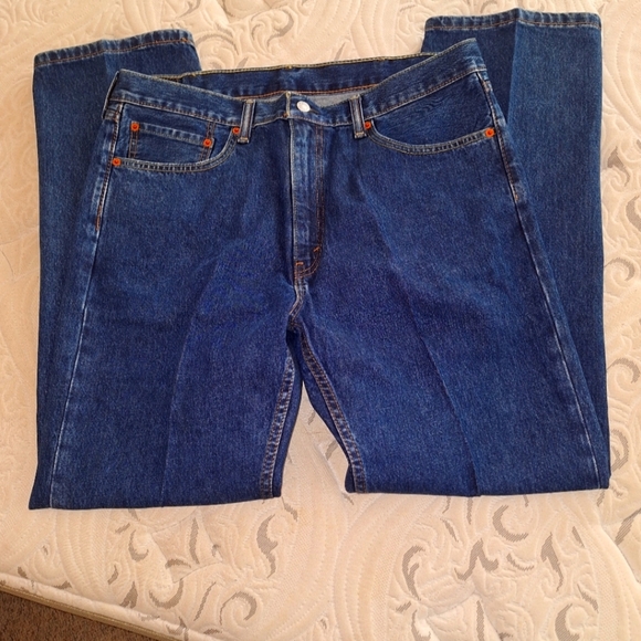 Levi's 505 men's denim jeans in a size 38x32. Like new condition. Blue jeans.
